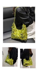 Close-up of vibrant neon yellow sequin tote bag showing detailed texture and shoulder strap