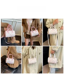 Multi-angle view of white Boston bag with cute cartoon prints and pink detachable strap
