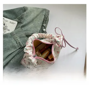 Detail view of floral bear quilted tote bag showing spacious interior with cosmetics