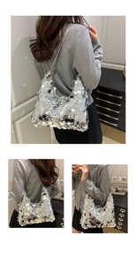 Macro shot of silver sequins on the shoulder bag with detailed metallic texture and shine