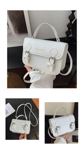 Detailed close-up of white leather tote featuring gold metal buckle and fashion logo text