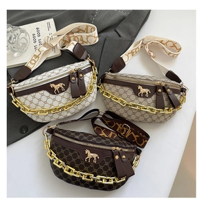 Detailed view of three vintage crossbody chest bags with gold horse logo and chain strap