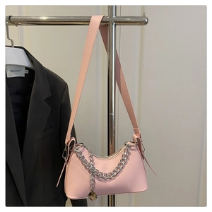 Pink crescent underarm bag with silver chunky chain and round pendant charm detail