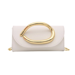 Minimalist white leather flap bag featuring a sculptural gold metal handle and chain strap