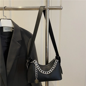 Fashionable black PU leather underarm bag with silver chain strap and metal pendant