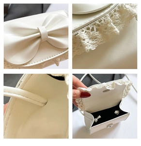 Detailed views of white mini bag with leather bow, lace trim and magnetic closure