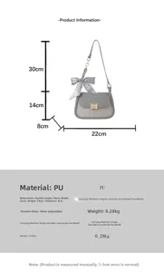 Detailed dimension guide for the two-tone crossbody bag featuring a bow charm