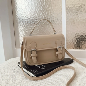Chic beige vintage messenger bag with top handle and adjustable strap for women