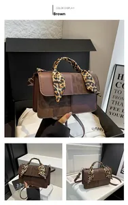Detailed view of brown leather crossbody bag with suede patchwork and leopard scarf handle