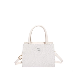 White faux crocodile leather handbag with top handles and adjustable shoulder strap