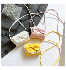 Detailed view of sweet mini crossbody bags with lace trim and bow knot in three candy colors