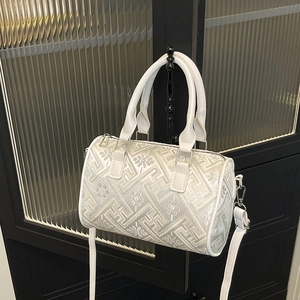 Elegant off-white checkered bucket bag with traditional embroidery and silver hardware