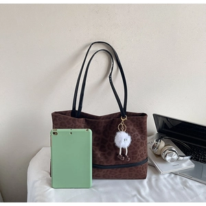 Brown leopard print tote bag with plush charm showing large capacity for tablets