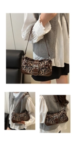 Detailed view of leopard print shoulder bag with brown leather trim and metallic buckle accents
