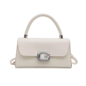Elegant cream white trapezoid handbag with sparkling diamond-encrusted G-shaped buckle