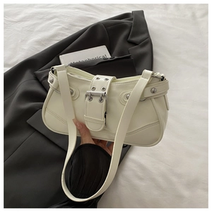 Detail of off-white PU leather hobo bag with Y2K buckles and silver rivets