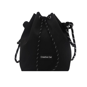 Chic black drawstring bucket bag with Creative Cat logo patch and woven cord strap