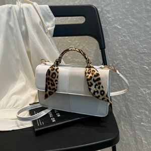 Minimalist white leather crossbody square bag with leopard print silk scarf on handle