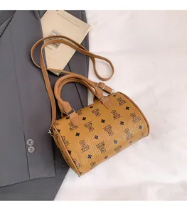 Detail of ginger pillow bag featuring bear patterns and adjustable silver buckles