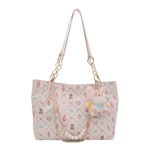 Cream tote bag with cartoon bear prints, pearl chain strap, and plush bunny charm