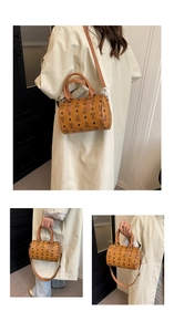 Detailed views of mini Boston bag with bear monogram pattern and adjustable strap