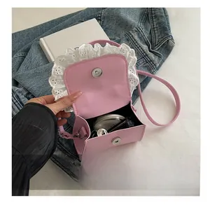 Internal view of pink mini lace handbag showing storage capacity for cosmetics