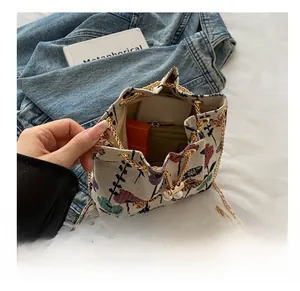 Interior view of vintage floral bucket bag showing space for phone and wallet