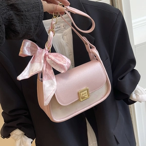 Chic pink and cream paneled shoulder bag with bow scarf and golden buckle detail
