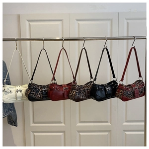 Collection of retro shoulder bags featuring large metal buckles and Y2K rivet hardware details