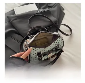 Detail of mint green crossbody bag showing spacious interior for a long wallet