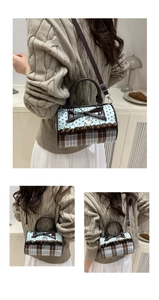 Detail of blue polka dot and plaid cylinder bag with brown ruffle trim and bow detail