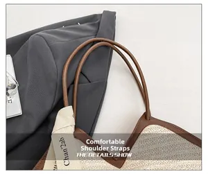 Detail of comfortable brown leather strap and woven texture on beige tote bag with scarf