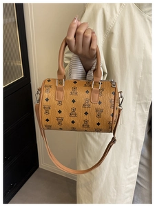 Detail of vintage Boston bag with bear print pattern and adjustable shoulder strap