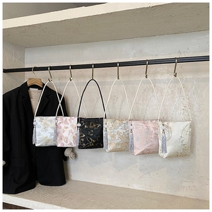 Detailed display of six Chinese style brocade bucket bags with floral patterns and tassels