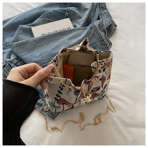 Inside view of floral bucket bag showing capacity for phone, wallet and lipstick