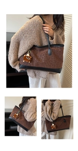 Detail of retro leopard print tote bag with plush charm and black leather handle straps