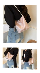 Detail of pink brocade tote bag featuring traditional Chinese patterns and silk tassel