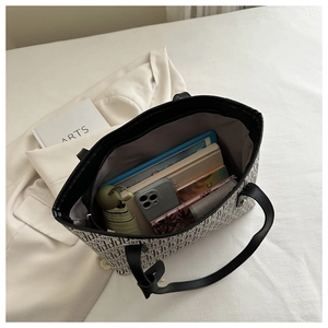 Top view of large tote bag interior showing ample storage for tablet, umbrella and laptop