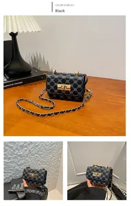 Close-up of vintage textured black jacquard pattern and golden metallic twist lock buckle