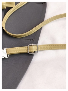 Detailed close-up of lime green PU leather shoulder strap with silver metal buckle