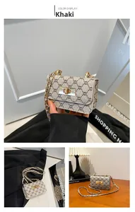Detail view of khaki monogram small square crossbody bag with gold chain and twist lock