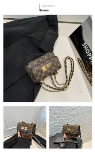 Detail of vintage brown crossbody bag with gold twist lock and chain strap hardware