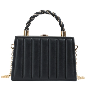 Chic black wave-pattern handbag with twisted handles and gold chain strap for women