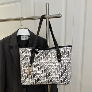Large monogram tote bag with letter prints and leather handles for office commuting