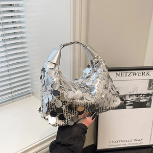 Sparkly silver sequin underarm bag with metal handle and bead accents for summer style