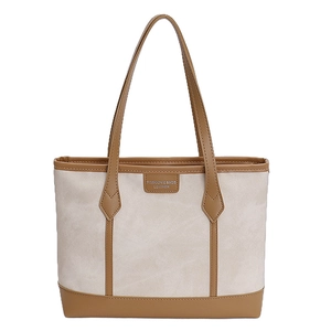 Large capacity beige canvas tote bag with brown leather trim and shoulder straps