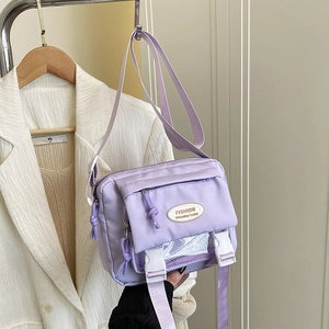 Minimalist light purple nylon crossbody bag for women with transparent mesh front pocket