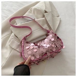 Detailed close-up of pink sequined shoulder bag showcasing shimmering large round sequins