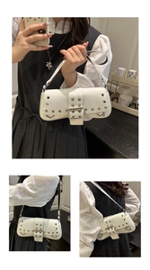 Detail of white punk Y2K underarm bag with silver rivets and large metal buckle