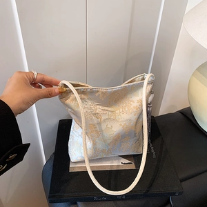New Chinese style satin jacquard bucket bag with landscape pattern and tassel detail
